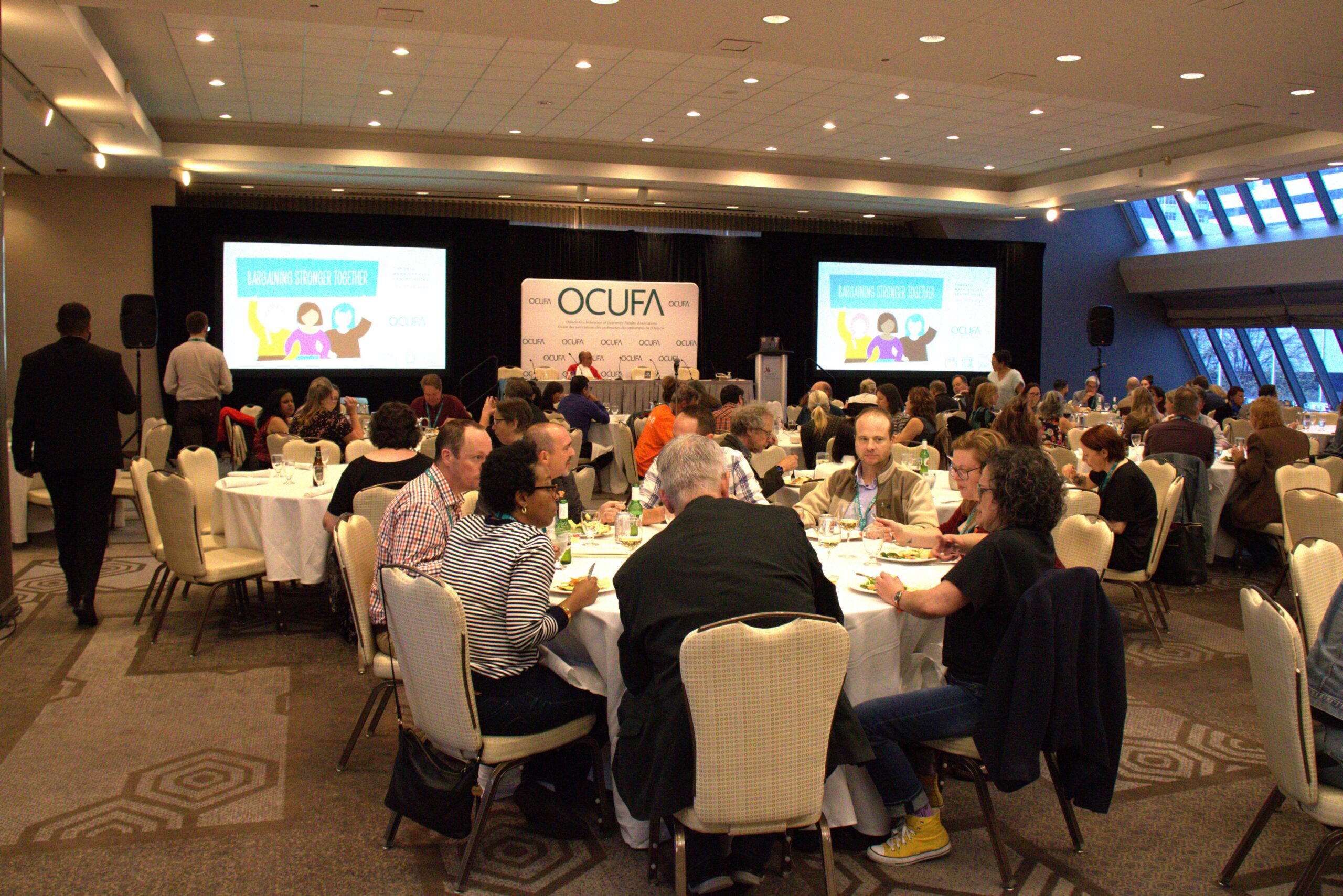 Participants chat before conference begins